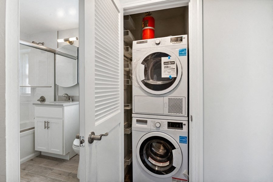a small laundry room with a washing machine and a dryer