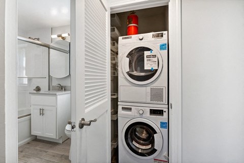 a small laundry room with a washing machine and a dryer
