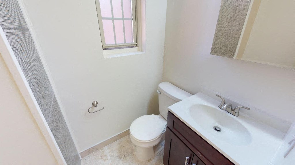 a bathroom with a toilet and a sink
