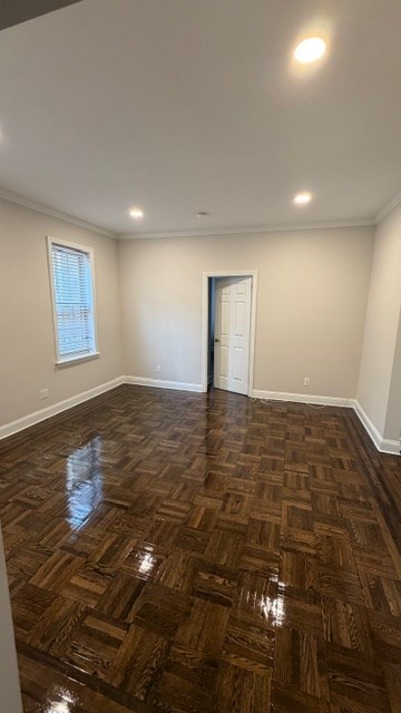 A room with a wooden floor and a door.