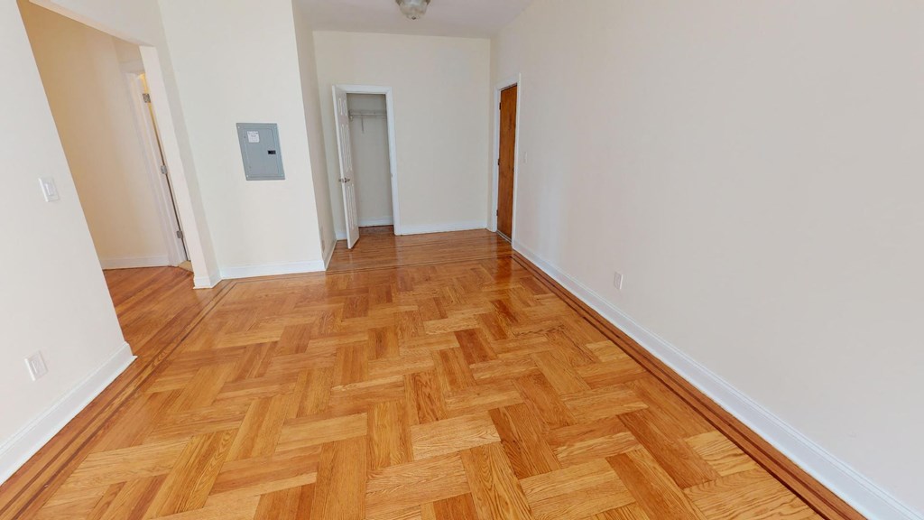 a empty room with a wooden floor