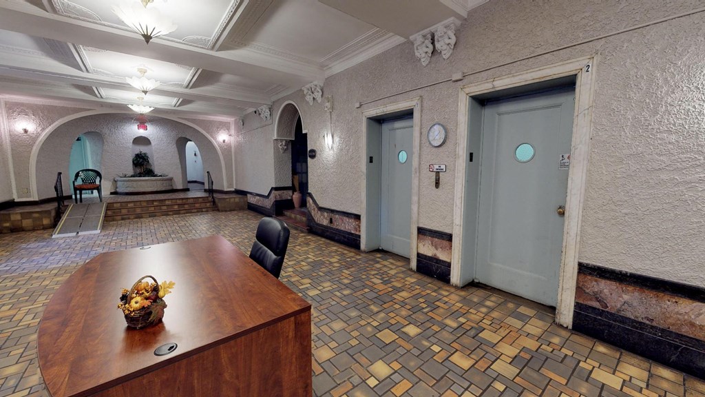 a conference room with a wooden table and two doors