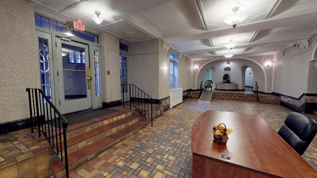 a conference room with a wooden table and stairs