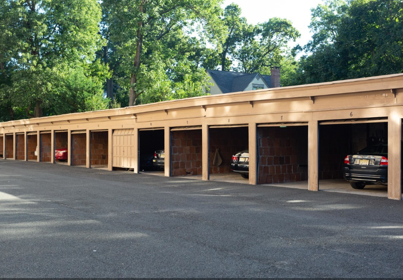 a covered parking garage with cars in it