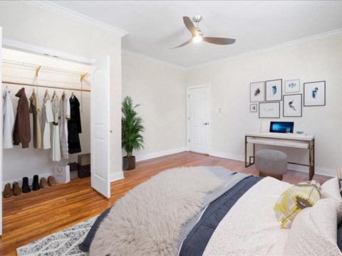 a bedroom with a bed and a closet