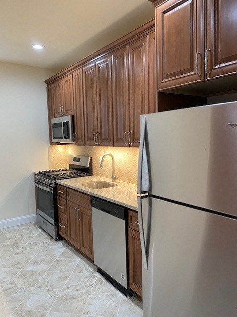 a kitchen with a stove and a refrigerator