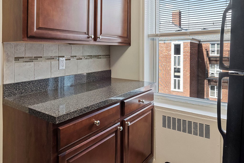 a kitchen with a counter and a window