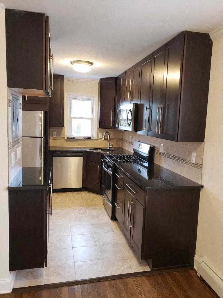 a kitchen with a stove and a refrigerator