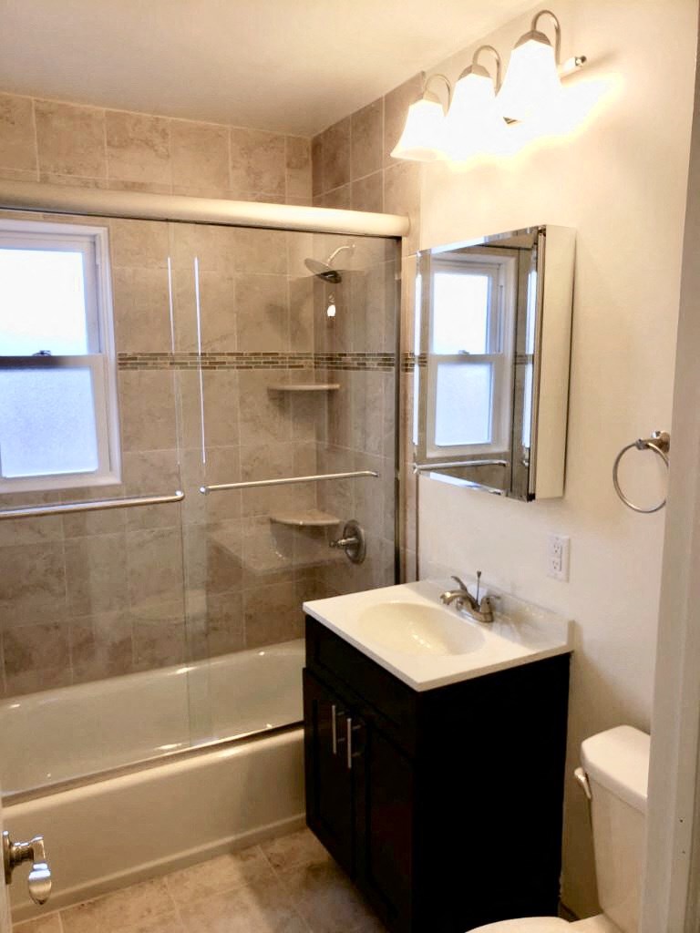 a bathroom with a sink and a shower