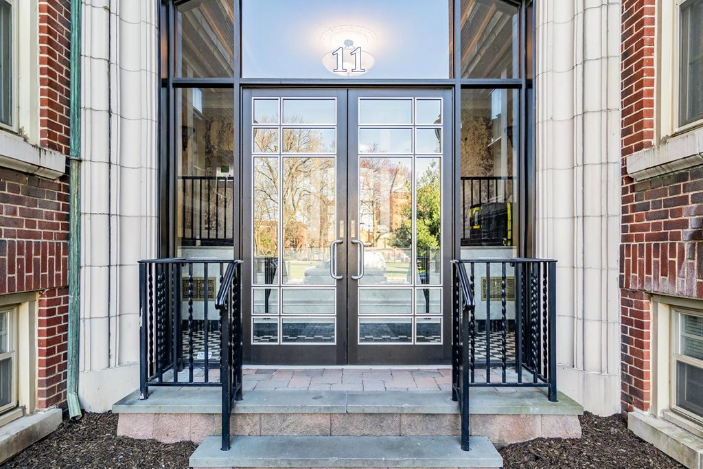 the entrance of a building with glass doors