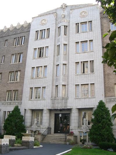 a large white building with a clock on top of it