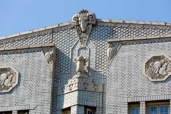 a building with a statue on the top of it