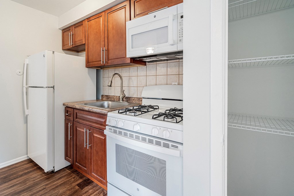 a kitchen with a stove microwave and refrigerator