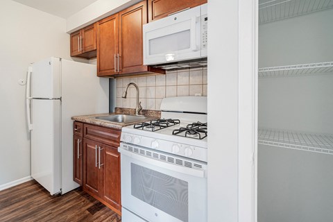 a kitchen with a stove microwave and refrigerator