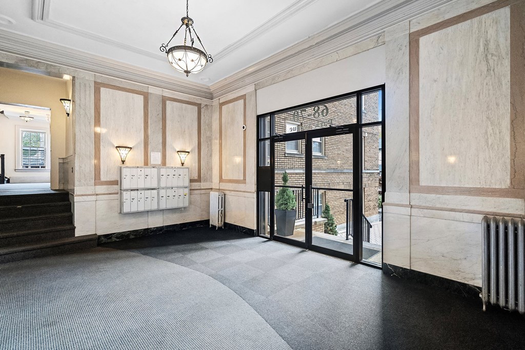 the lobby of a building with a large glass door