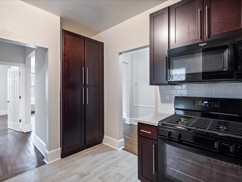 a kitchen with a stove and a microwave