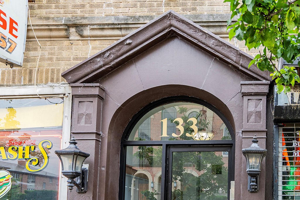 a building with a window with the number 133 on it