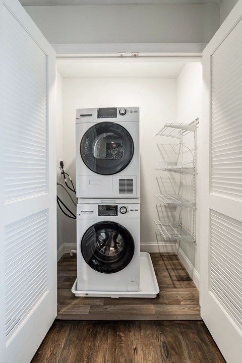 a washer and dryer in a small laundry room