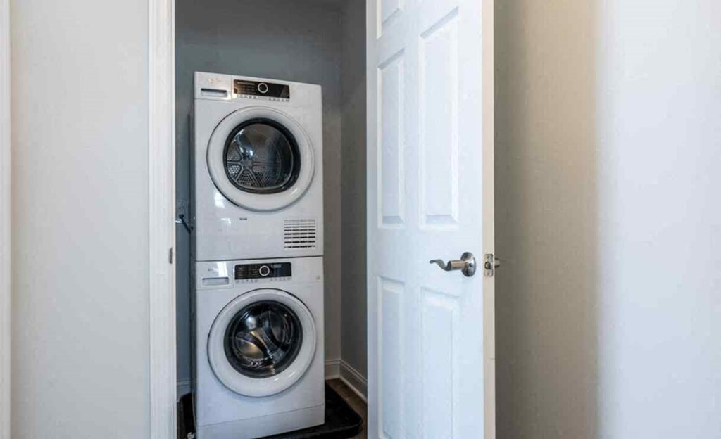 a small laundry room with a washer and dryer