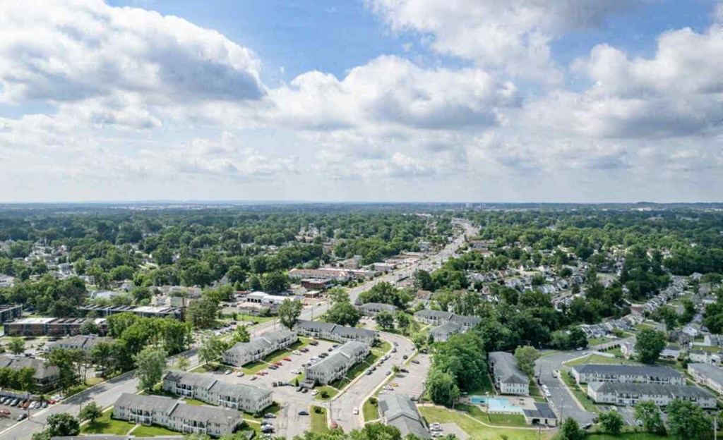 an aerial view of a neighborhood with houses and trees
