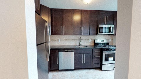 a kitchen with a stove and a refrigerator