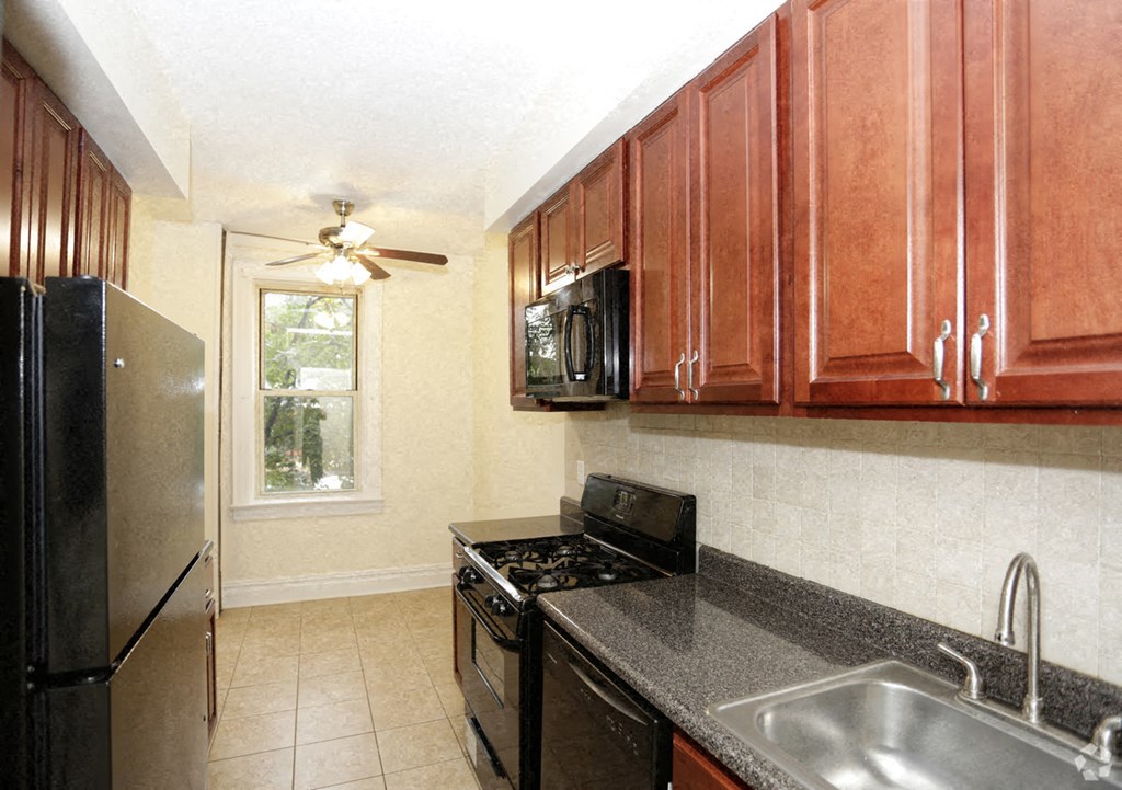 a kitchen with a sink and a refrigerator