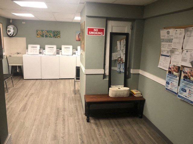 a voting room in a voting center with voting machines and a table