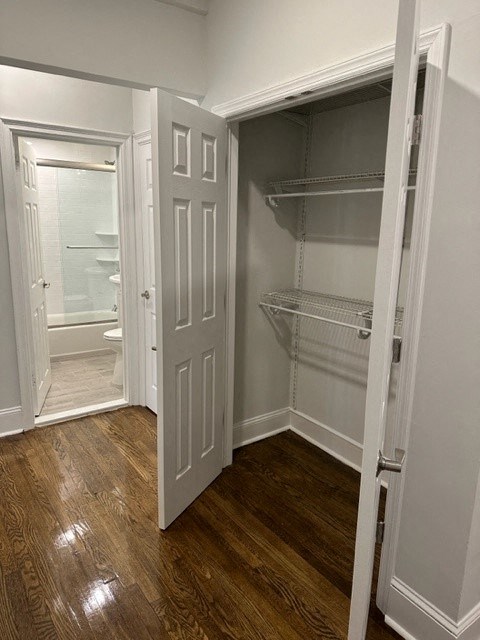 a room with a closet and a white door