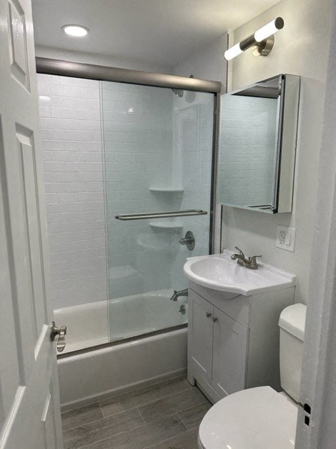 a white bathroom with a shower and a sink