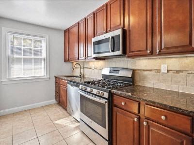 a kitchen with a stove and a microwave