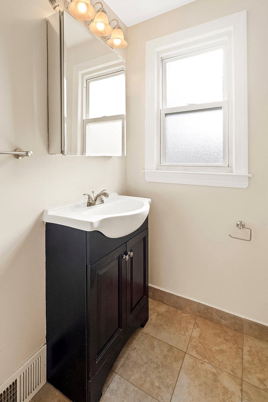 a small bathroom with a sink and a mirror