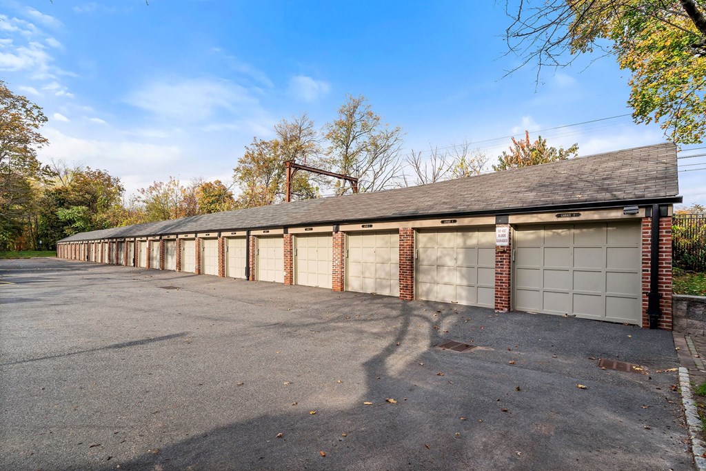 a long row of garage doors on the side of a house