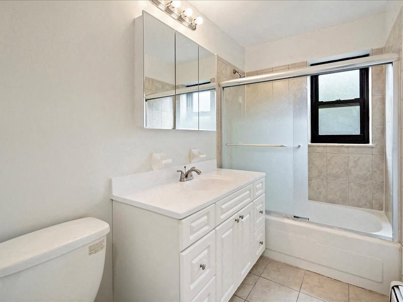 a bathroom with a sink toilet and a shower