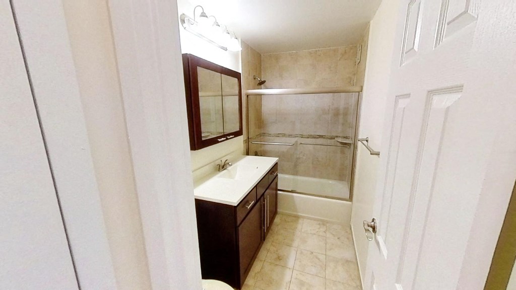 a bathroom with a sink and a shower