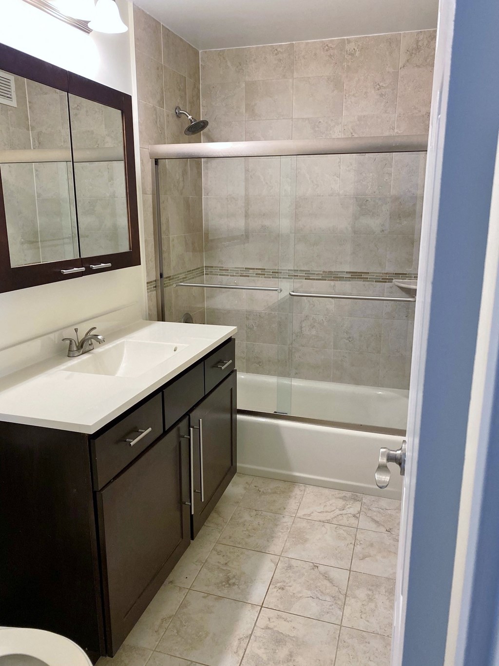 a small bathroom with a sink and a shower