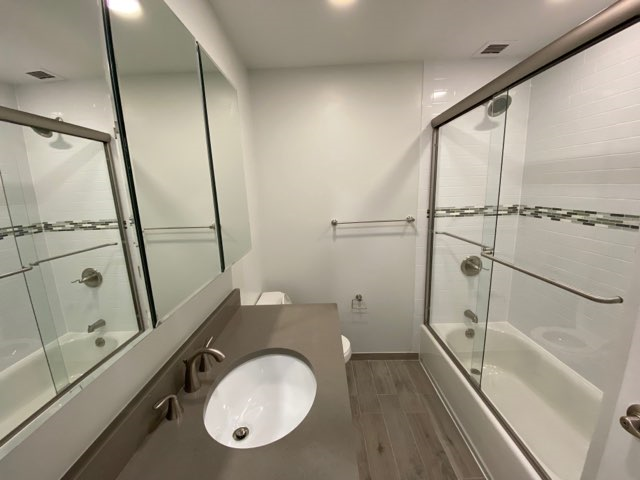 a bathroom with a sink and a shower