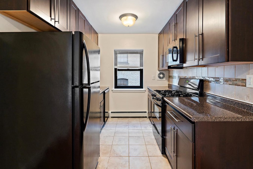 a kitchen with stainless steel appliances and a counter top