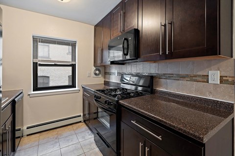 a kitchen with a stove and a microwave