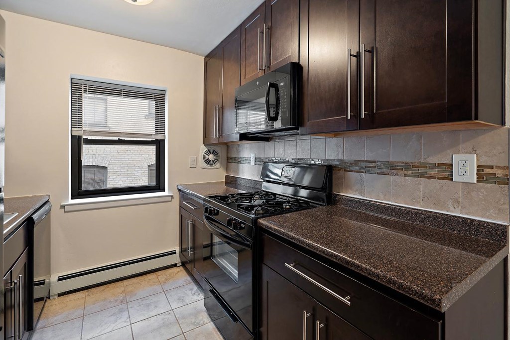 a kitchen with a stove and a microwave