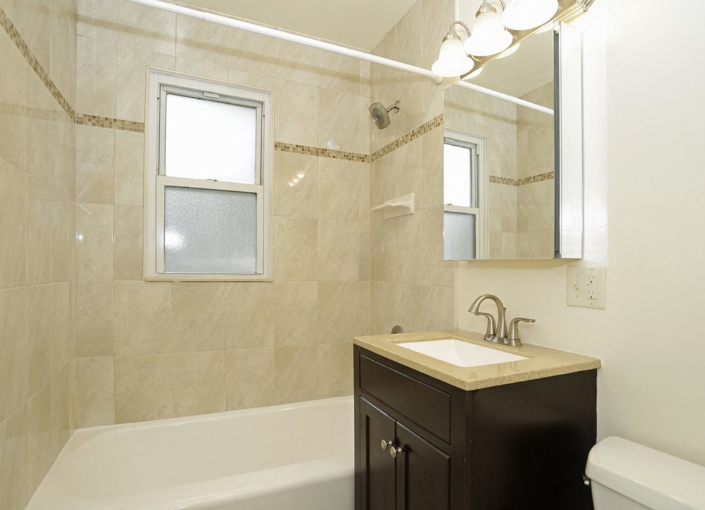 a bathroom with a sink and a bath tub