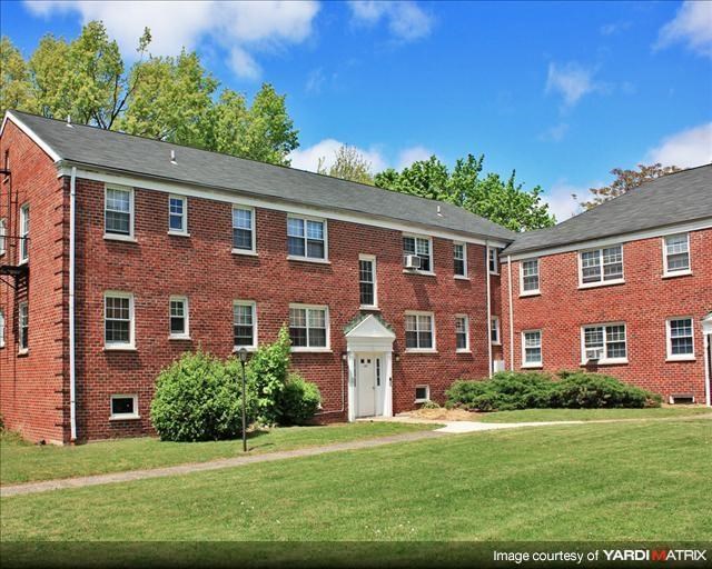 a red brick building with a white door