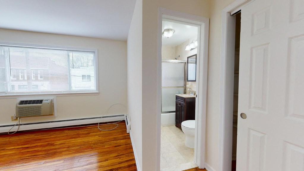 a small bathroom with a toilet and a window