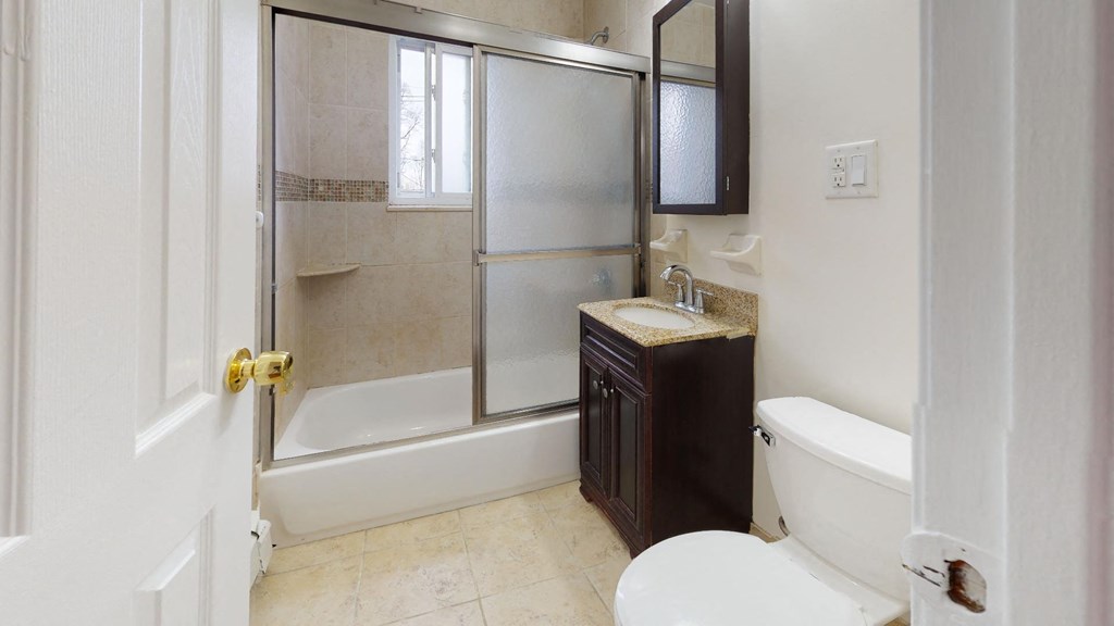 a bathroom with a sink toilet and a shower
