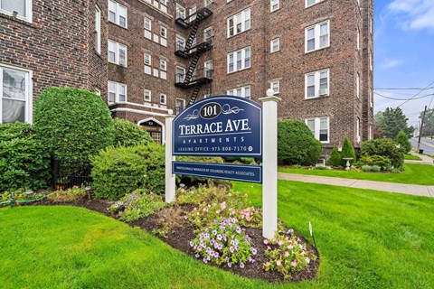 our sign in front of our building in the yard