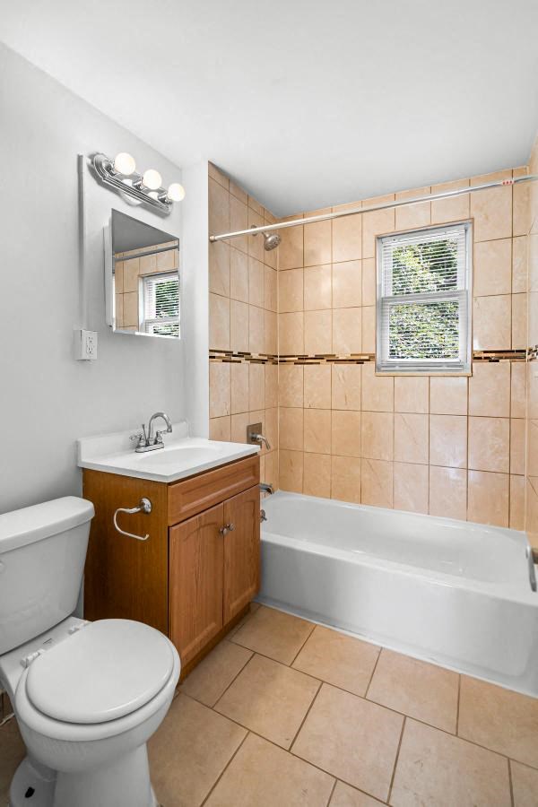 a bathroom with a toilet sink and a bath tub