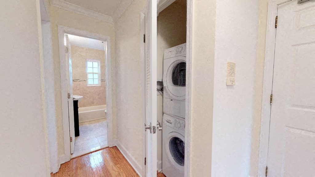 a small laundry room with a washing machine and a dryer