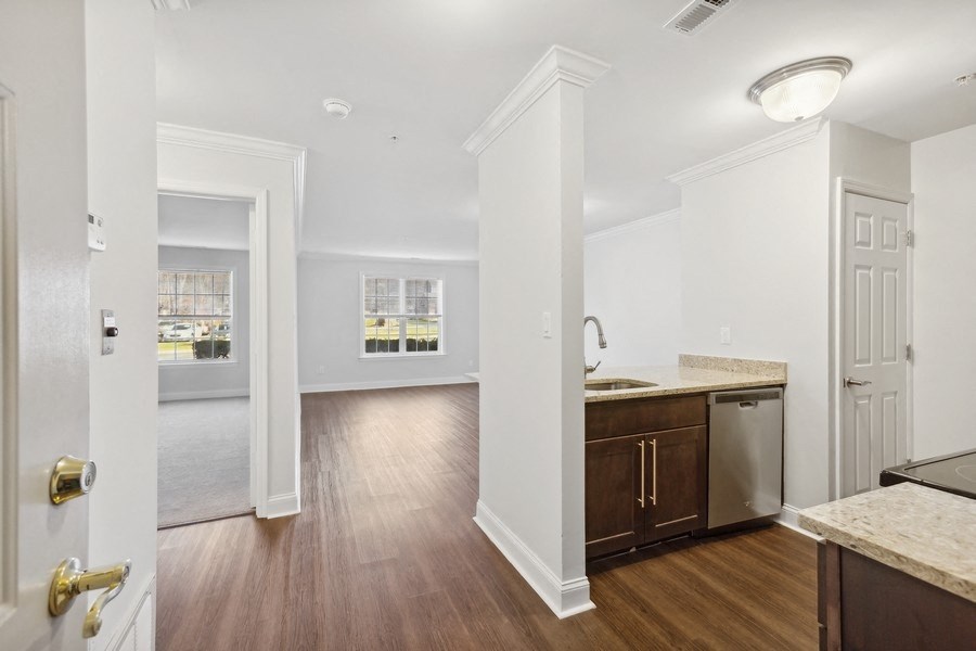 a renovated kitchen and living room in a new home