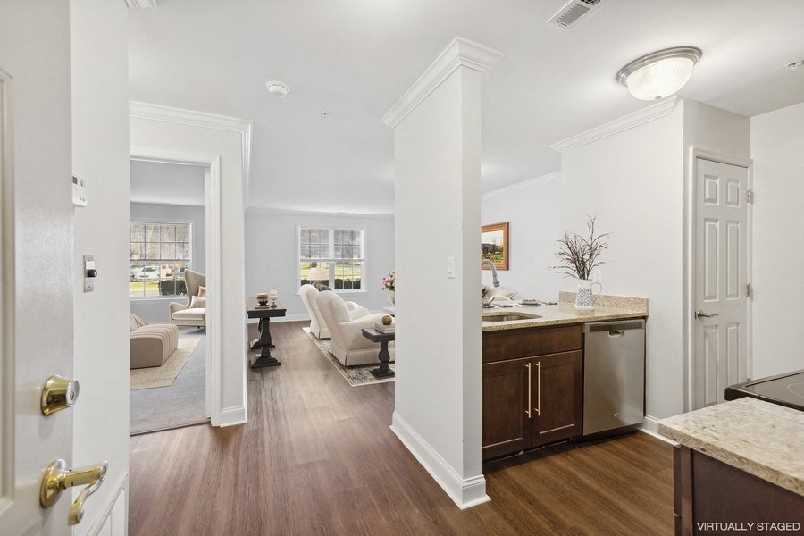 a renovated kitchen and living room in a new home
