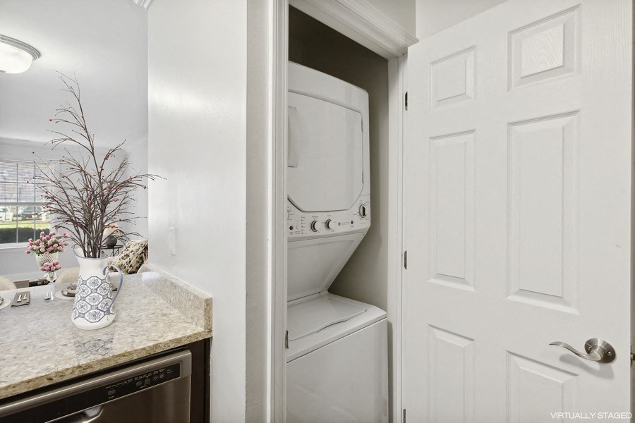 a small laundry room with a washer and dryer in it
