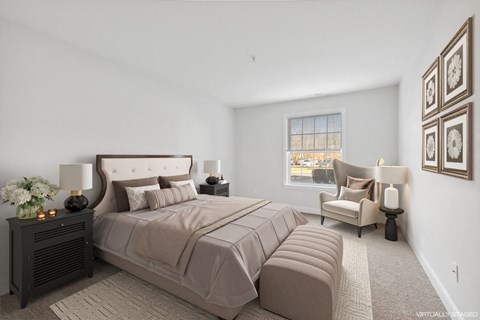 a master bedroom with a large bed and a window